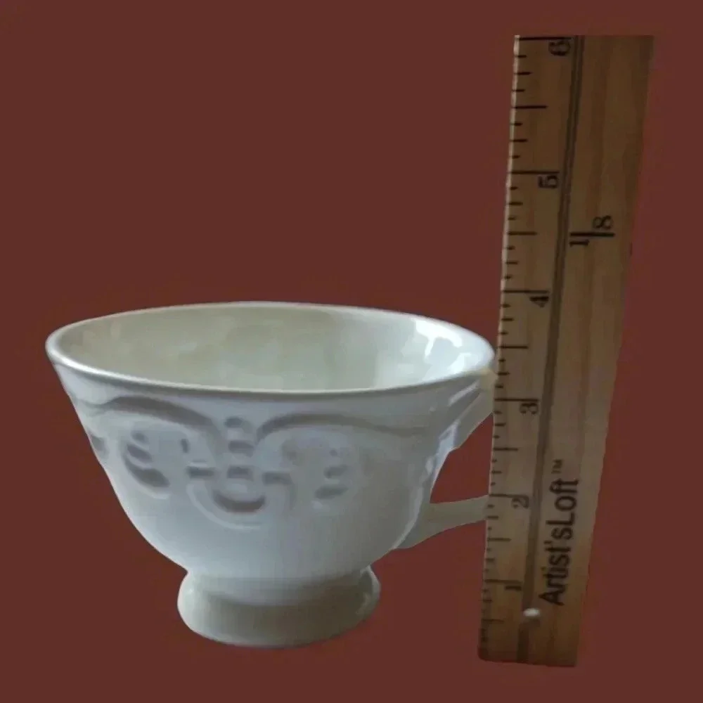 Shabby chic porcelain teacup and saucer